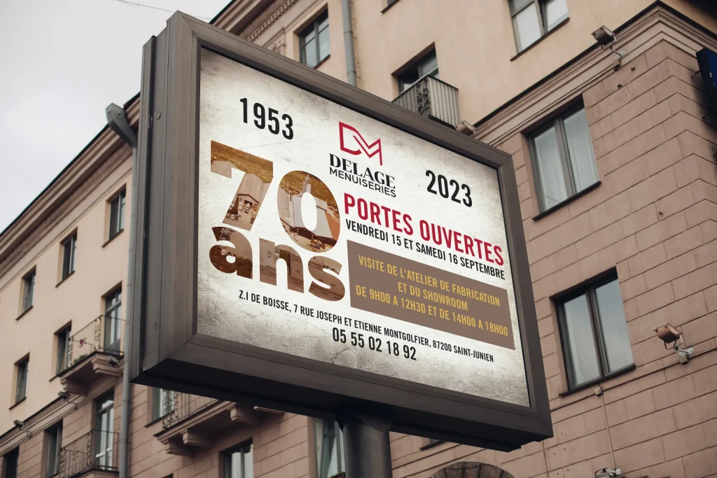 Affiche des 70 ans de Delage Menuiseries sur un panneau d’affichage en ville