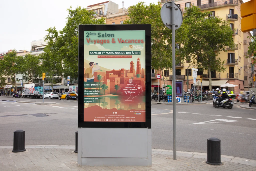 Affiche du 2e Salon Voyages et Vacances des Voyages de Micheline sur un panneau sucette